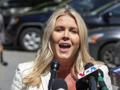 FILE - Karoline Leavitt speaks to the news media across the street from Republican presidential nominee former President Donald Trump's criminal trial in New York, May 28, 2024. (AP Photo/Ted Shaffrey, File)