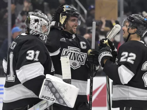 Nov 16, 2024; Los Angeles, California, USA; Los Angeles Kings goaltender David Rittich (31) is congratulated by center Anze Kopitar (11) and left wing Kevin Fiala (22) after defeating the Detroit Red Wings at Crypto.com Arena. Mandatory Credit: Jayne Kamin-Oncea-Imagn Images