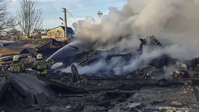 In this photo provided by the Ukrainian Emergency Service, emergency services personnel work to extinguish a fire following a Russian rocket attack in Lviv, Ukraine, Sunday, Nov. 17, 2024. (Ukrainian Emergency Service via AP)