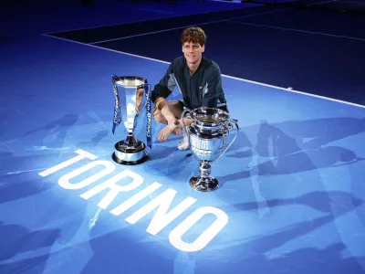 17 November 2024, Italy, Turin: Italian tennis player Jannik Sinner celebrates with the trophies after winning the ATP World Tour Finals Men's Singles tennis match against US Taylor Fritz at the Inalpi Arena. Photo: Marco Alpozzi/LaPresse via ZUMA Press/dpa