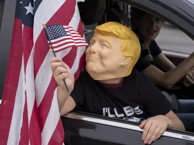 Supporters of President-elect Donald Trump participate in a victory parade, Sunday, Nov. 17, 2024, in West Palm Beach, Fla. (AP Photo/Alex Brandon)