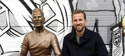 Harry Kane poses during the unveiling of a statue of himself at The Peter May Centre in London, Monday Nov. 18, 2024. (Zac Goodwin/PA via AP)