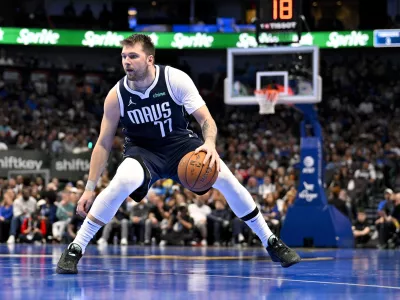 Nov 19, 2024; Dallas, Texas, USA; Dallas Mavericks guard Luka Doncic (77) brings the ball up court against the New Orleans Pelicans during the second half at the American Airlines Center. Mandatory Credit: Jerome Miron-Imagn Images