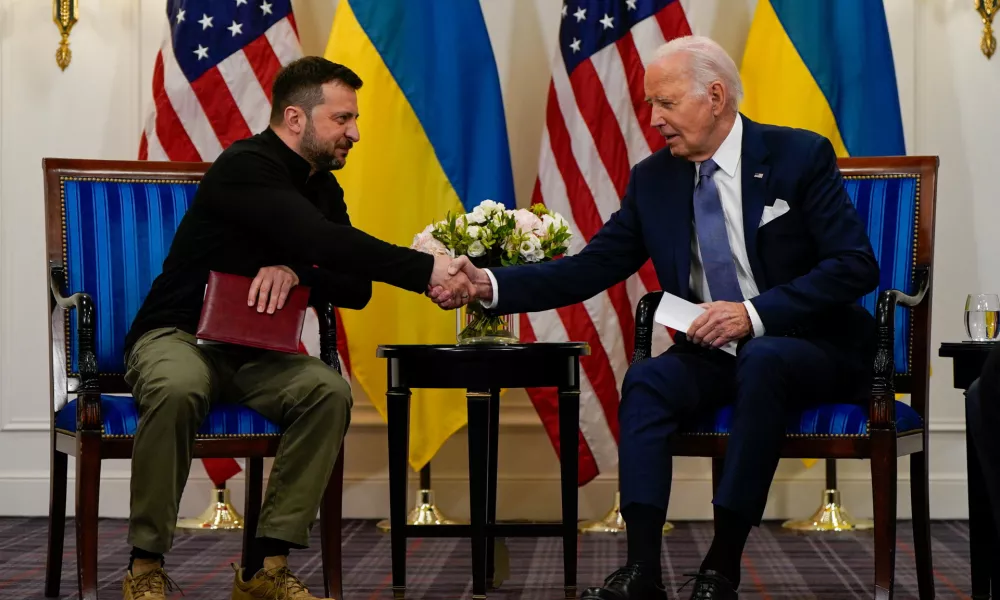 U.S. President Joe Biden shakes hands with Ukrainian President Volodymyr Zelenskiy in Paris, France, June 7, 2024. REUTERS/Elizabeth Frantz REFILE - QUALITY REPEAT