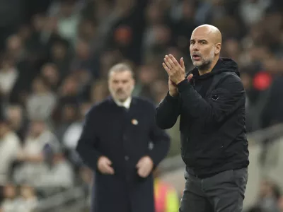 Manchester City's head coach Pep Guardiola reacts during the English League Cup fourth round soccer match between Tottenham and Manchester City, at the Tottenham Hotspur Stadium in London, Wednesday, Oct 30, 2024. (AP Photo/Ian Walton)