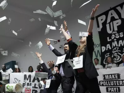 Activists participate in a demonstration for climate finance at the COP29 U.N. Climate Summit, Thursday, Nov. 21, 2024, in Baku, Azerbaijan. (AP Photo/Sergei Grits)