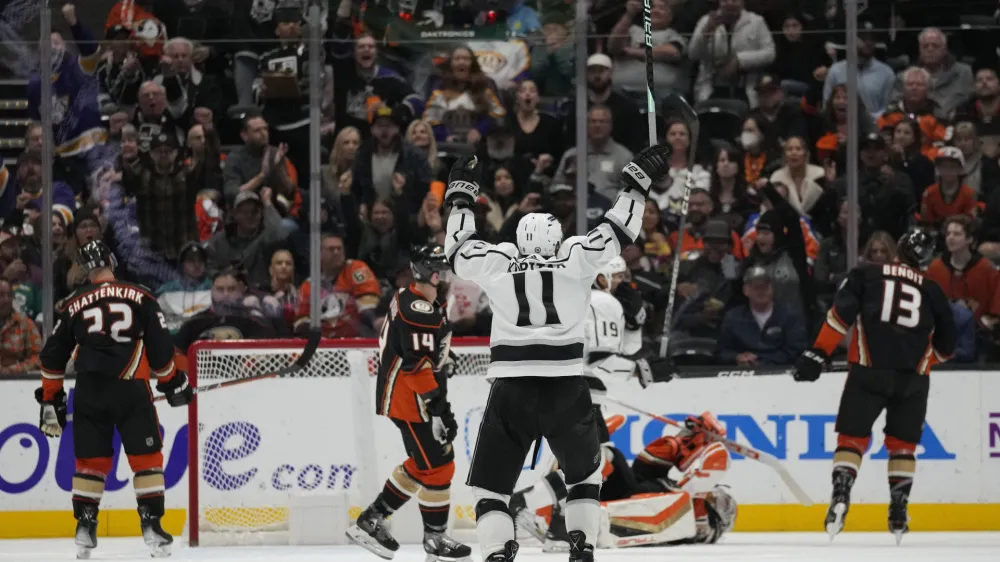 Los Angeles Kings center Anze Kopitar (11) celebrates after right wing Adrian Kempe (9) scored during the third period of an NHL hockey game against the Anaheim Ducks in Anaheim, Calif., Thursday, April 13, 2023. (AP Photo/Ashley Landis)