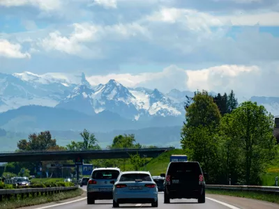 MKHR75 Highway traffic with a mountain range in the background, Switzerland, Europe