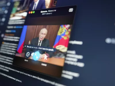 The broadcast of the televised address of Russian President Vladimir Putin is seen on a screen in Moscow, Russia, Thursday, Nov. 21, 2024. (AP Photo/Pavel Bednyakov)