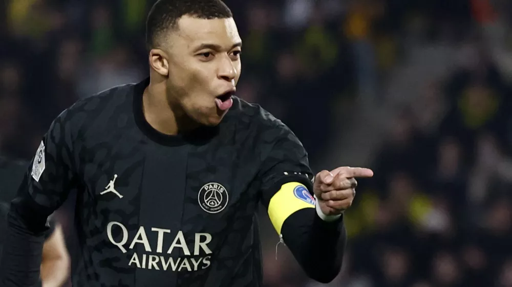 Soccer Football - Ligue 1 - Nantes v Paris St Germain - The Stade de la Beaujoire - Louis Fonteneau, Nantes, France - February 17, 2024 Paris St Germain's Kylian Mbappe celebrates scoring their second goal REUTERS/Stephane Mahe