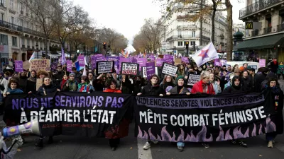 People attend a demonstration to protest against femicide, sexual violence and all gender-based violence to mark the International Day for Elimination of Violence Against Women, in Paris, France, November 23, 2024. The banners read: "We won't serve the rearming of the state" and "Sexist violences, fascist violences, same feminist fight". REUTERS/Abdul Saboor