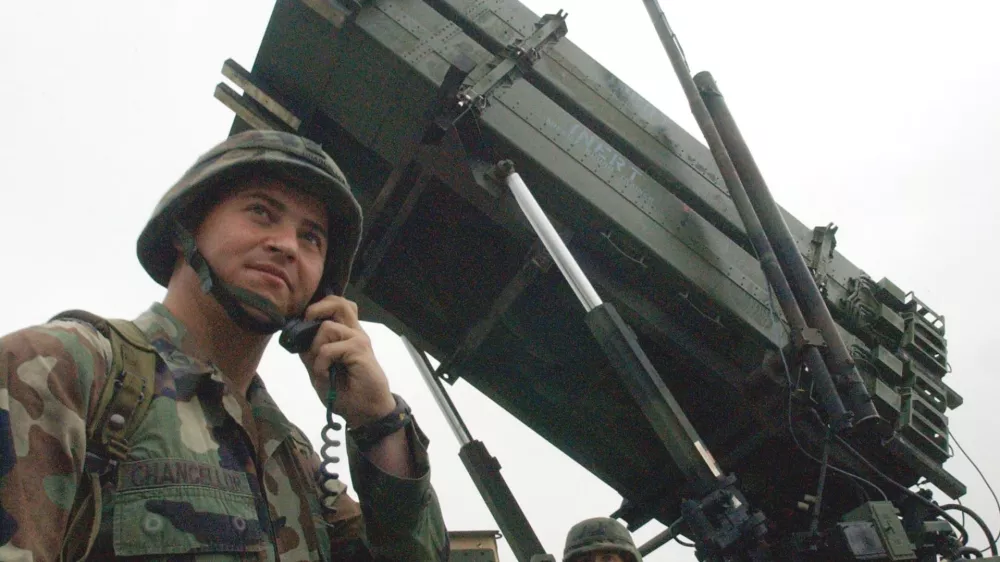 ** FILE ** A U.S Army soldier uses a radio near a Patriot Advanced Capability-3 missile system at a Korean military air base in Suwon, south of Seoul, Thursday, Sept. 18, 2003. Tokyo and Washington will deploy advanced Patriot interceptor missiles in Japan for the first time, officials said Monday, June 26, 2006 amid concerns North Korea may be preparing to test-fire a long-range ballistic missile. (AP Photo/Ahn Young-joon)