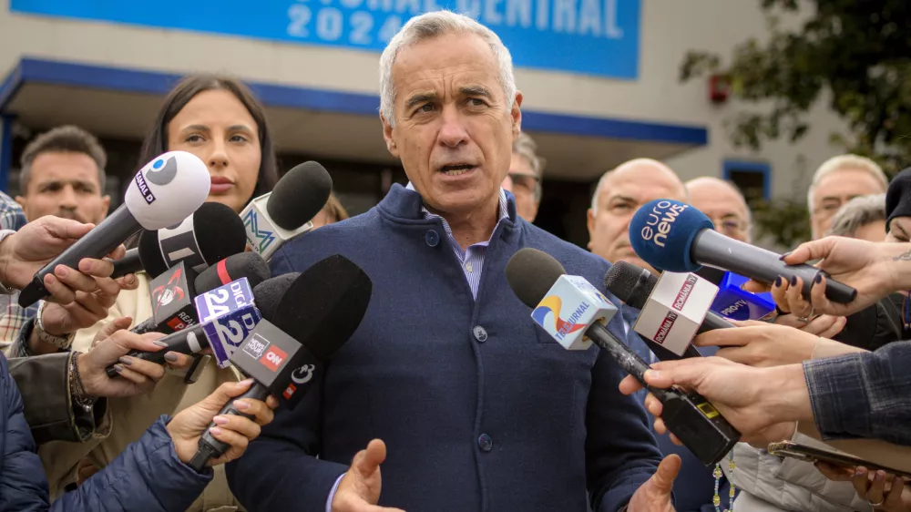 Calin Georgescu, running as an independent candidate for president, speaks to media after registering his bid in the country's presidential elections, in Bucharest, Romania, Tuesday, Oct. 1, 2024. (AP Photo/Alexandru Dobre)