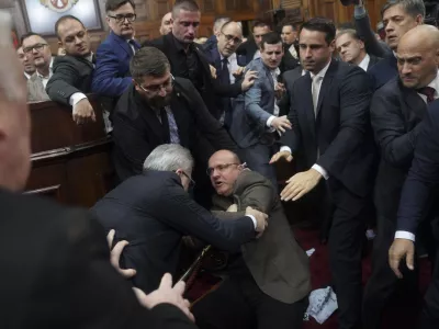 Ruling party lawmakers, opposition members, and some ministers fight during a Serbia's parliament session, which was scheduled to debate the 2025 budget, in Belgrade, Serbia, Monday, Nov. 25, 2024. (AP Photo)