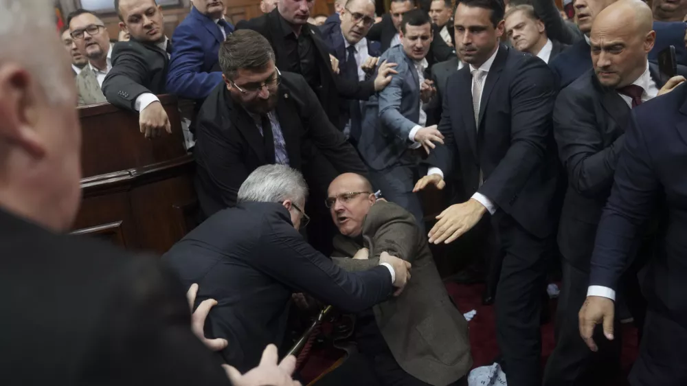 Ruling party lawmakers, opposition members, and some ministers fight during a Serbia's parliament session, which was scheduled to debate the 2025 budget, in Belgrade, Serbia, Monday, Nov. 25, 2024. (AP Photo)