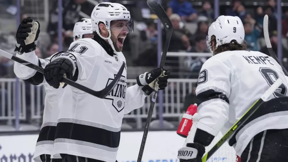 Los Angeles Kings center Anze Kopitar (11) reacts after scoring a goal during the second period of an NHL hockey game against the San Jose Sharks, Monday, Nov. 25, 2024, in San Jose, Calif. (AP Photo/Godofredo A. Vásquez)