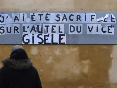 The slogan which reads "I was sacrificed on the altar of vice, Gisele" is seen on a city wall during the trial of Dominique Pelicot, a Frenchman accused of drugging his then-wife Gisele Pelicot and recruiting dozens of strangers to rape her at their home in the southern French town of Mazan, and 50 co-accused, with 50 co-accused, in Avignon, France, November 26, 2024. REUTERS/Alexandre Dimou