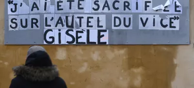 The slogan which reads "I was sacrificed on the altar of vice, Gisele" is seen on a city wall during the trial of Dominique Pelicot, a Frenchman accused of drugging his then-wife Gisele Pelicot and recruiting dozens of strangers to rape her at their home in the southern French town of Mazan, and 50 co-accused, with 50 co-accused, in Avignon, France, November 26, 2024. REUTERS/Alexandre Dimou