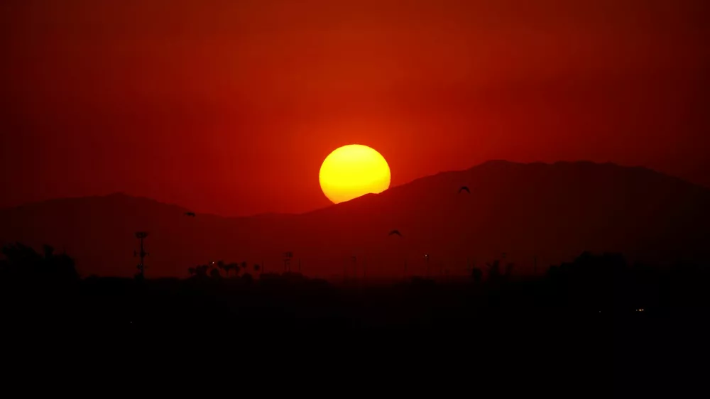 FILE PHOTO: The sun sets during a heatwave, in Mexicali, Mexico July 5, 2024. REUTERS/Victor Medina/File Photo