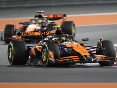 McLaren driver Lando Norris of Britain leads his teammate McLaren driver Oscar Piastri of Australia during sprint race at the Formula One Qatar Grand Prix, at the Lusail International Circuit in Lusail, Qatar, Saturday, Nov. 30, 2024. (AP Photo/ Darko Bandic)