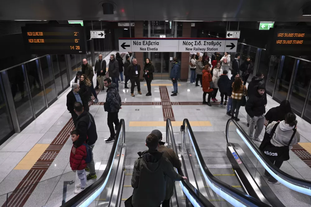 Commuters inside a metro station during the inauguration day of the Thessaloniki metro, in Thessaloniki, northern Greece, Saturday, Nov. 30, 2024. (AP Photo/Giannis Papanikos)