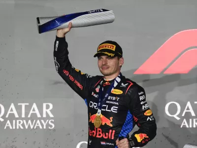 Red Bull driver Max Verstappen of the Netherlands celebrates after winning the Qatar Formula One Grand Prix at the Lusail International Circuit in Lusail, Qatar, Sunday, Dec. 1, 2024. (AP Photo/Altaf Qadri)