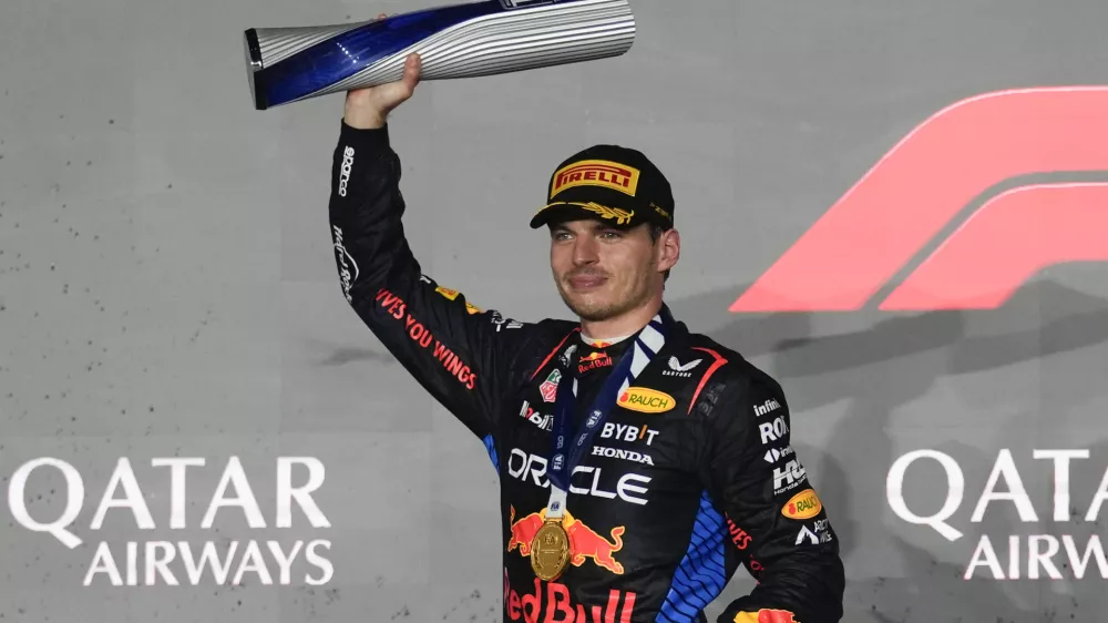 Red Bull driver Max Verstappen of the Netherlands celebrates after winning the Qatar Formula One Grand Prix at the Lusail International Circuit in Lusail, Qatar, Sunday, Dec. 1, 2024. (AP Photo/Altaf Qadri)