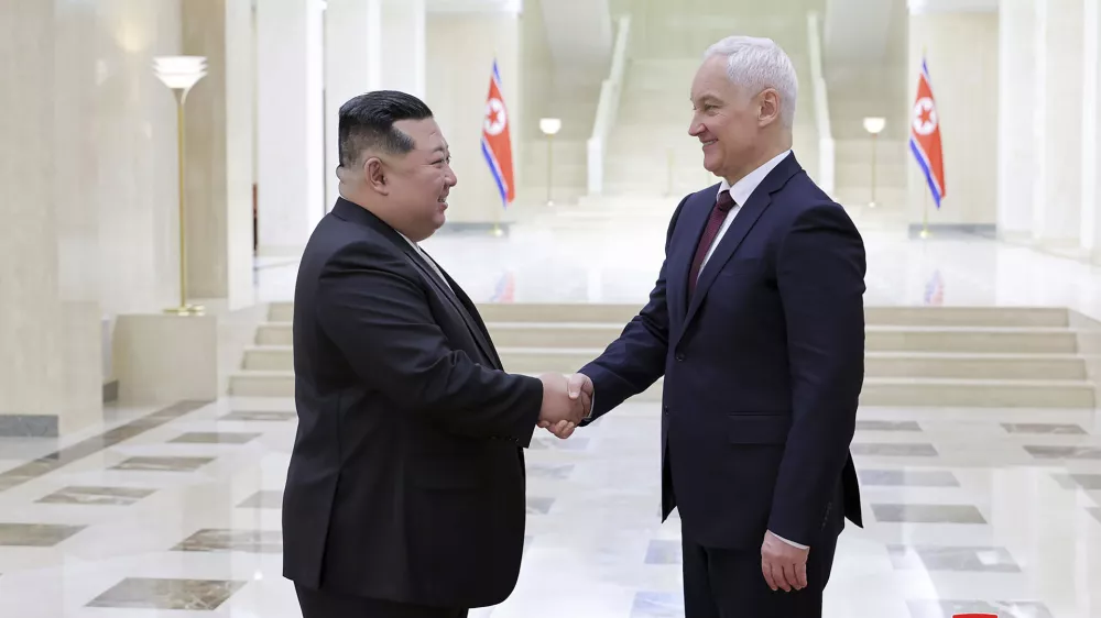 In this photo provided by the North Korean government, North Korean leader Kim Jong Un, left, shakes hands with Russian Defense Minister Andrei Belousov in Pyongyang, North Korea Friday, Nov. 29, 2024. Independent journalists were not given access to cover the event depicted in this image distributed by the North Korean government. The content of this image is as provided and cannot be independently verified. Korean language watermark on image as provided by source reads: "KCNA" which is the abbreviation for Korean Central News Agency. (Korean Central News Agency/Korea News Service via AP)