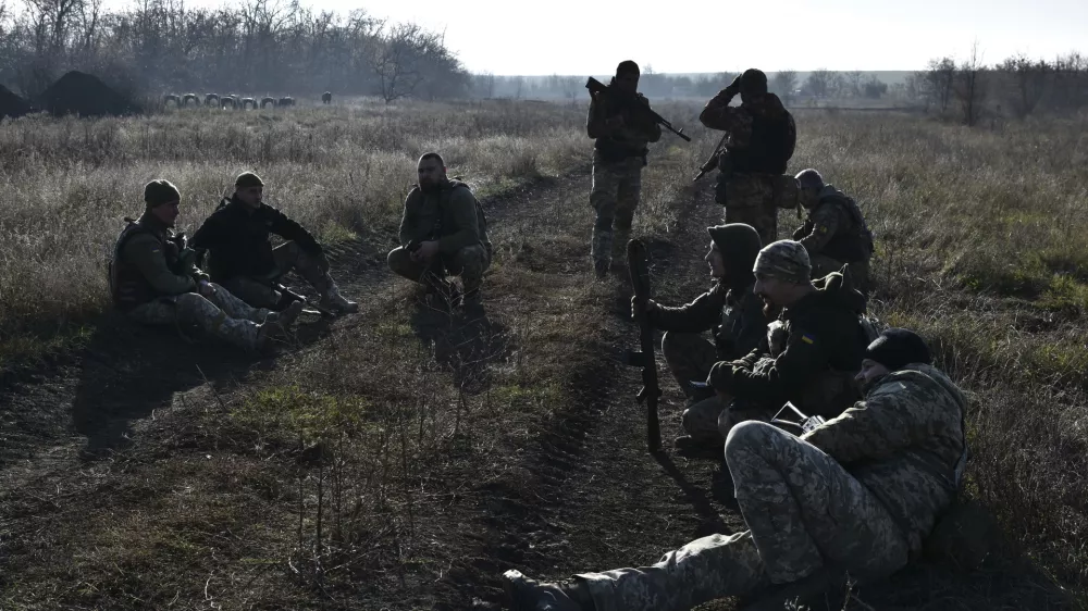 In this photo provided by the Ukraine's 65th Mechanised Brigade press service on Nov. 19, 2024, Ukrainian soldiers rest during a training at a polygon in Zaporizhzhia region, Ukraine. (Andriy Andriyenko/Ukraine's 65th Mechanised Brigade via AP)