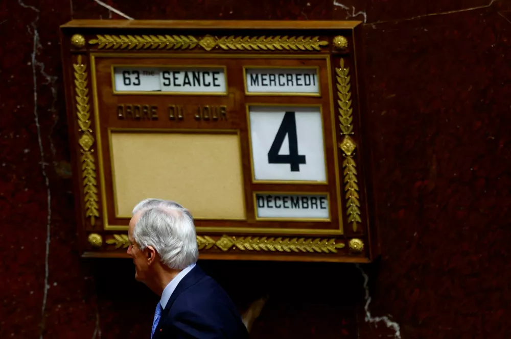 French Prime Minister Michel Barnier leaves after the questions to the government session before a vote on no-confidence motion against the French government at the National Assembly in Paris, France, December 4, 2024. REUTERS/Sarah Meyssonnier   TPX IMAGES OF THE DAY