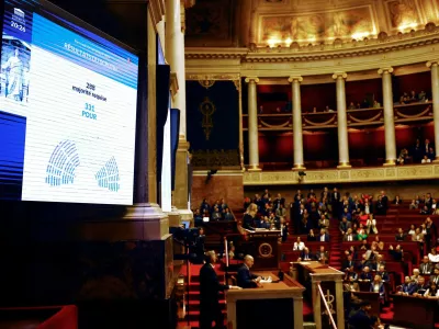 A screen shows the result of the vote on the first motion of no-confidence against the French government, tabled by the alliance of left-wing parties the "Nouveau Front Populaire" (New Popular Front - NFP), after the use by French government of the article 49.3, a special clause in the French Constitution, to push the budget bill through the National Assembly without a vote by lawmakers, at the National Assembly in Paris, France, December 4, 2024. REUTERS/Sarah Meyssonnier