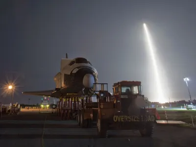 The SpaceX Falcon 9 test rocket lifts off from Space Launch Complex 40 at the Cape Canaveral Air Force Station in Cape Canaveral, Florida May 22, 2012. The rocket blasted off on Tuesday for a mission designed to be the first commercial flight to the International Space Station. The mock shuttle Explorer, in the foreground, had been on display at the Kennedy Space Center Complex, and will be moved to the Johnson Space Center in Houston this week in order to make room for the arrival of Space Shuttle Atlantis. REUTERS/Pierre DuCharme (UNITED STATES - Tags: SCIENCE TECHNOLOGY TRANSPORT TPX IMAGES OF THE DAY)