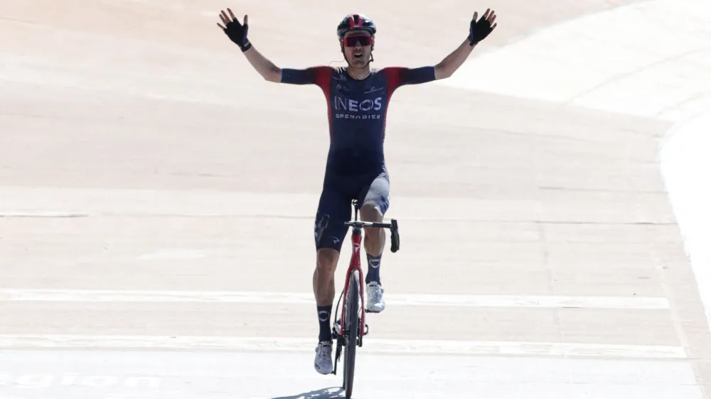 Cycling - Paris-Roubaix - Roubaix Velodrome, Roubaix, France - April 17, 2022 Ineos Grenadiers rider Dylan van Baarle of the Netherlands celebrates as he crosses the line to win the race REUTERS/Pascal Rossignol