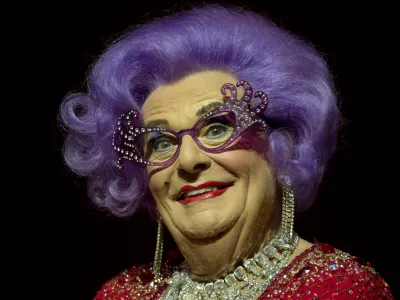 FILE - Australian TV presenter Barry Humphries performs on stage as Dame Edna for the Farewell Tour, at the London Palladium theatre, in central London, on Nov. 13, 2013. Tony Award-winning comedian Barry Humphries, internationally renowned for his garish stage persona Dame Edna Everage, a condescending and imperfectly-veiled snob whose evolving character has delighted audiences over seven decades, died on Saturday, April 22, 2023, after spending several days in a Sydney hospital with complications following hip surgery, a Sydney hospital said. He was 89 years old. (Photo by Joel Ryan/Invision/AP, File)