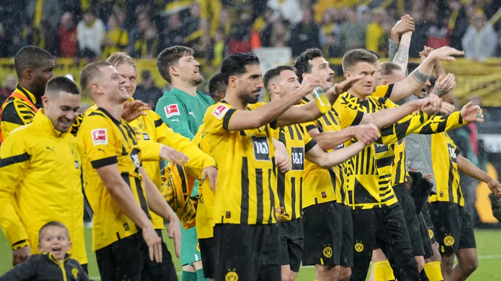 Dortmund players celebrates after defeating Eintracht Frankfurt during the German Bundesliga soccer match between Borussia Dortmund and Eintracht Frankfurt in Dortmund, Germany, Saturday, April 22, 2023. (AP Photo/Martin Meissner)