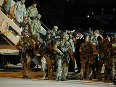 24 April 2023, Italy, Rome: Military Forces stand as Italian citizens disembark an Air Force plane carrying Italian citizens evacuated from Sudan landed at the Ciampino Military airport. Photo: Domenico Cippitelli/LPS via ZUMA Press Wire/dpa