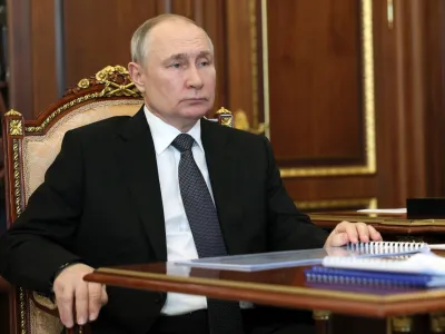 Russian President Vladimir Putin listens to United Russia Party General Council Secretary Andrei Turchak during their meeting at the Kremlin in Moscow, Russia, Monday, April 24, 2023. (Mikhail Klimentyev/Sputnik, Kremlin Pool Photo via AP)