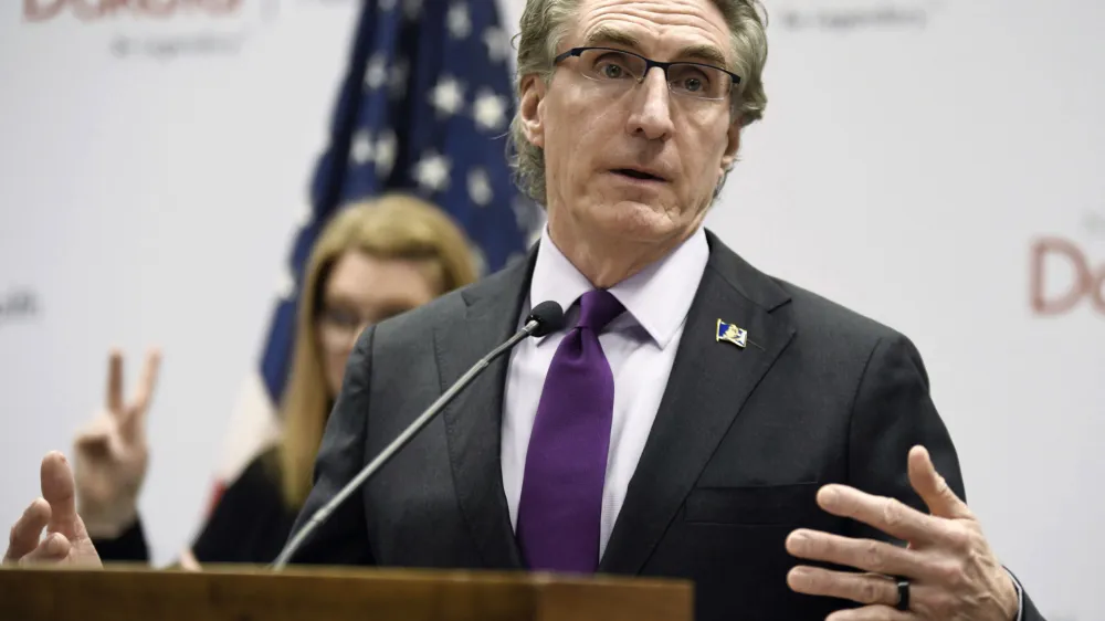 FILE - North Dakota Gov. Doug Burgum speaks at the state Capitol on April 10, 2020, in Bismarck, N.D. Burgum signed an abortion ban at six weeks of pregnancy — even in cases of rape or incest — into law on Monday, April 24, 2023. (Mike McCleary/The Bismarck Tribune via AP, File)