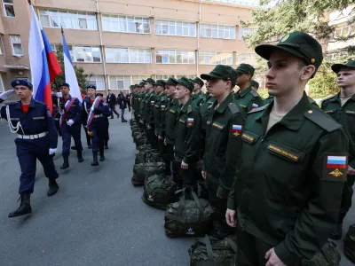 Russian conscripts called up for military service line up before their departure for garrisons as they gather at a recruitment centre in Simferopol, Crimea, April 25, 2023. REUTERS/Alexey Pavlishak