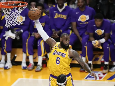 Los Angeles Lakers' LeBron James grabs a rebound during the first half in Game 6 of the team's first-round NBA basketball playoff series against the Memphis Grizzlies on Friday, April 28, 2023, in Los Angeles. (AP Photo/Jae C. Hong)