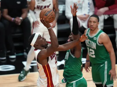 May 23, 2023; Miami, Florida, USA; Miami Heat forward Jimmy Butler (22) shoot against Boston Celtics guard Jaylen Brown (7) in the fourth quarter during game four of the Eastern Conference Finals for the 2023 NBA playoffs at Kaseya Center. Mandatory Credit: Jim Rassol-USA TODAY Sports