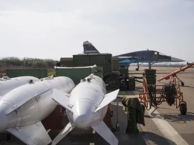 ﻿FILE - In this Thursday, Oct. 22, 2015, file photo, bombs lie near a Russian war plane at Hemeimeem airbase, Syria. When Russian Foreign Minister Sergey Lavrov said his country is ready to aid Syrian rebels fighting Islamic State militants on the ground, rebel commanders scoffed at the notion, pointing out that Russian aircraft were pounding rebel bases in central and northern Syria on daily basis. (AP Photo/Vladimir Isachenkov, File)