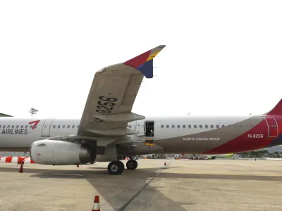 An Asiana Airlines plane is parked as one of the plane's doors suddenly opened at Daegu International Airport in Daegu, South Korea, Friday, May 26, 2023. A passenger opened a door on an Asiana Airlines flight that later landed safely at a South Korean airport Friday, airline and government officials said. (Yun Kwan-shick/Yonhap via AP)