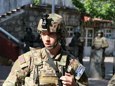 A Polish Kosovo Force (KFOR) soldier stands guard at a municipal office in Zvecan, Kosovo May 30, 2023. REUTERS/Miodrag Draskic