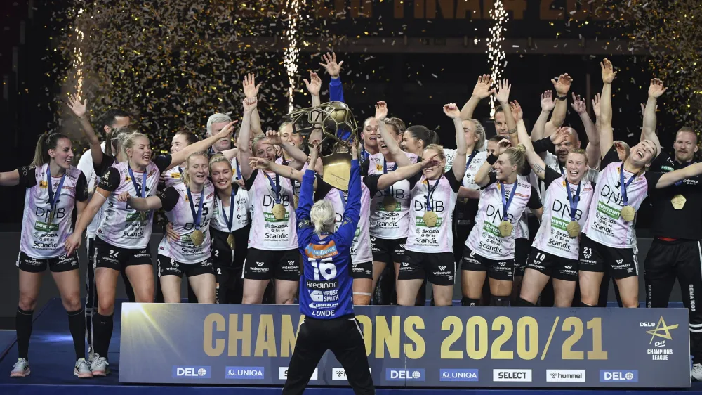 ﻿Players of Vipers Kristiansand celebrate with the trophy after they won women's handball Champions' League final match Vipers Kristiansand vs. Brest Bretagne Handball in Papp Laszlo Budapest Sports Arena in Budapest, Hungary, Sunday, May 30, 2021. (Tibor Illyes/MTI via AP)