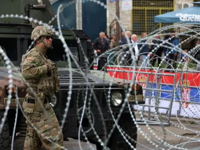 A U.S. Kosovo Force (KFOR) soldier, under NATO, stands guard near a municipal office in Leposavic, Kosovo May 31, 2023. REUTERS/Fatos Bytyci