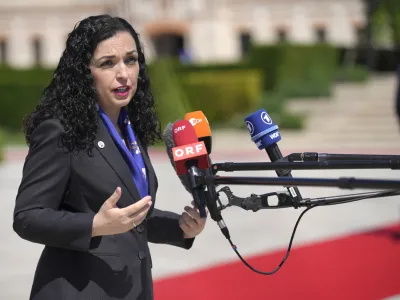 Kosovo's President Vjosa Osmani-Sadriu speaks with the media as she arrives for the European Political Community Summit at the Mimi Castle in Bulboaca, Moldova, Thursday, June 1, 2023. Leaders are meeting in Moldova Thursday for a summit aiming to show a united front in the face of Russia's war in Ukraine and underscore support for the Eastern European country's ambitions to draw closer to the West and keep Moscow at bay. (AP Photo/Vadim Ghirda)