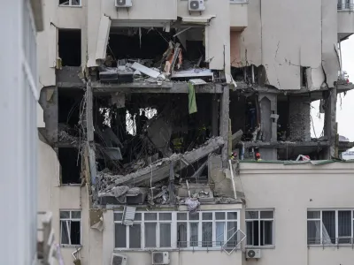 A view of an apartment building damaged following a Russian attack in Kyiv, Ukraine, Saturday, June 24, 2023. (AP Photo/Andrew Kravchenko)