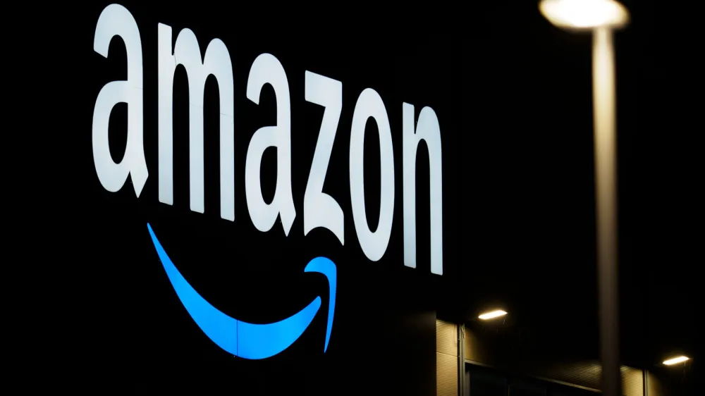 FILED - 17 December 2020, Brandenburg, Schoenefeld: Amazon's logo is seen at the online retailer's logistics center. Photo: Soeren Stache/dpa-Zentralbild/dpa