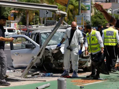 Israeli security and emergency personnel work at the scene of a ramming attack in Tel Aviv, Israel July 4, 2023. REUTERS/Amir Cohen